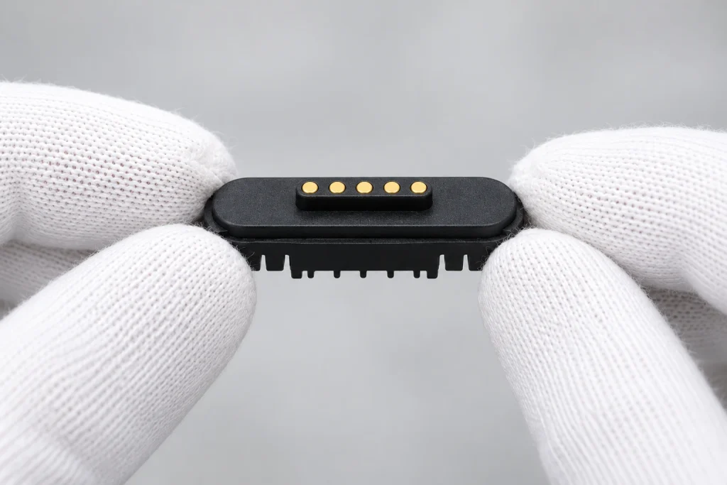 Five-contact sample held for visual inspection.