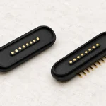 Two eight-contact oval device receptacles, with eight through-hole tails on one component.