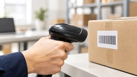 Handheld barcode scanner in a logistics setting.