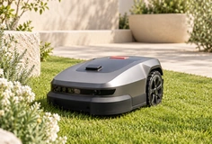 Robot lawn mower in a landscaped garden; application concept.