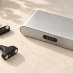 Four-contact power bank, original magnetic cable head and two mating counterparts on a pale stone surface.