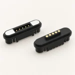 Five-contact black mating pair with mounting grooves and rectangular end magnets.