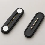 Eight-contact magnetic connector pair with original circular end magnets.
